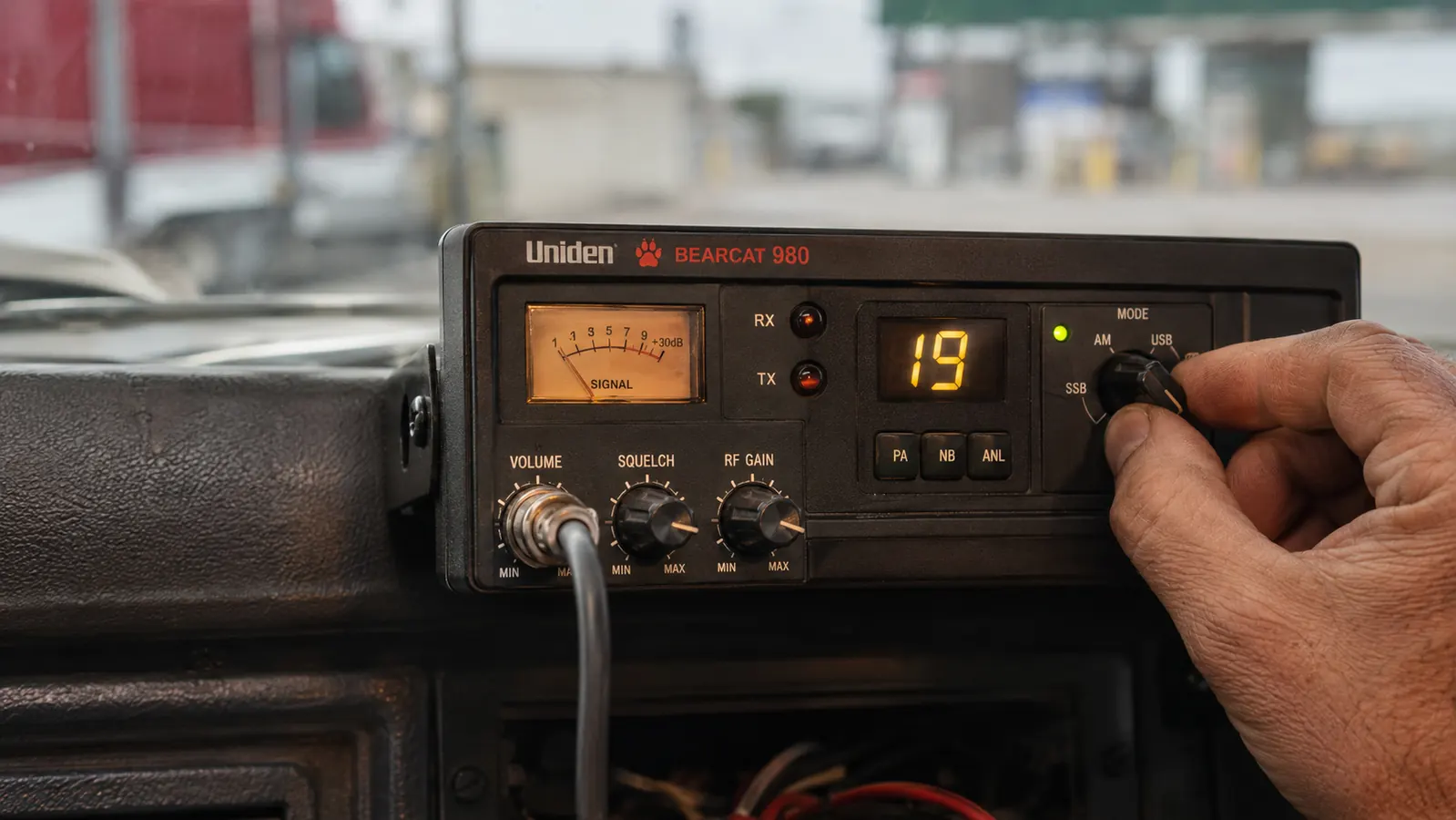 Close-up of the Uniden BEARCAT 980 front panel showing the SSB toggle and backlit controls