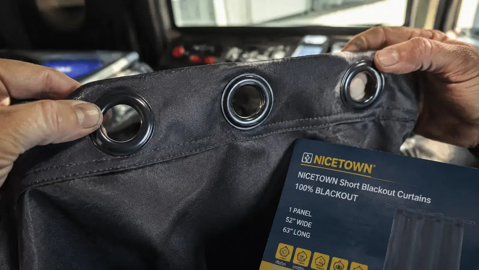 NICETOWN curtain panel grommet line close-up showing stitching detail under bright shop light